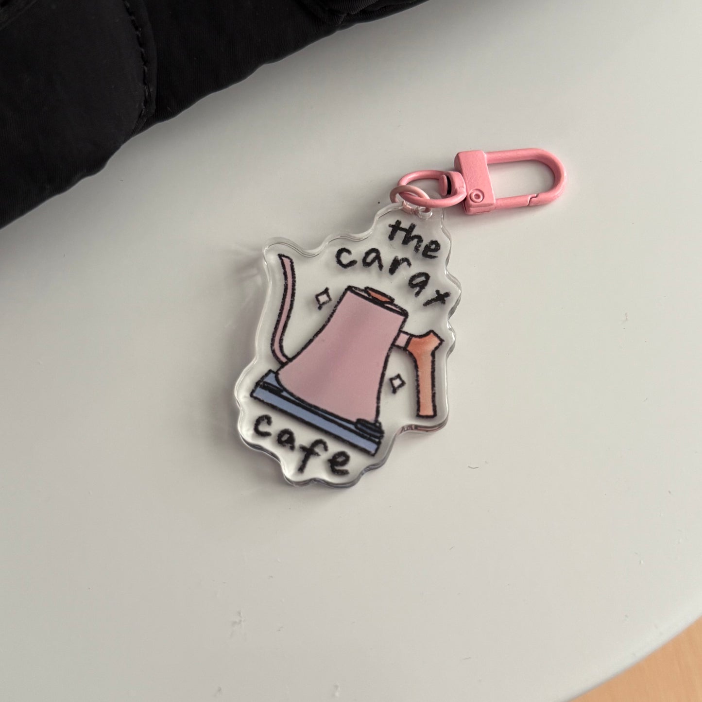 the carat cafe acrylic keychain